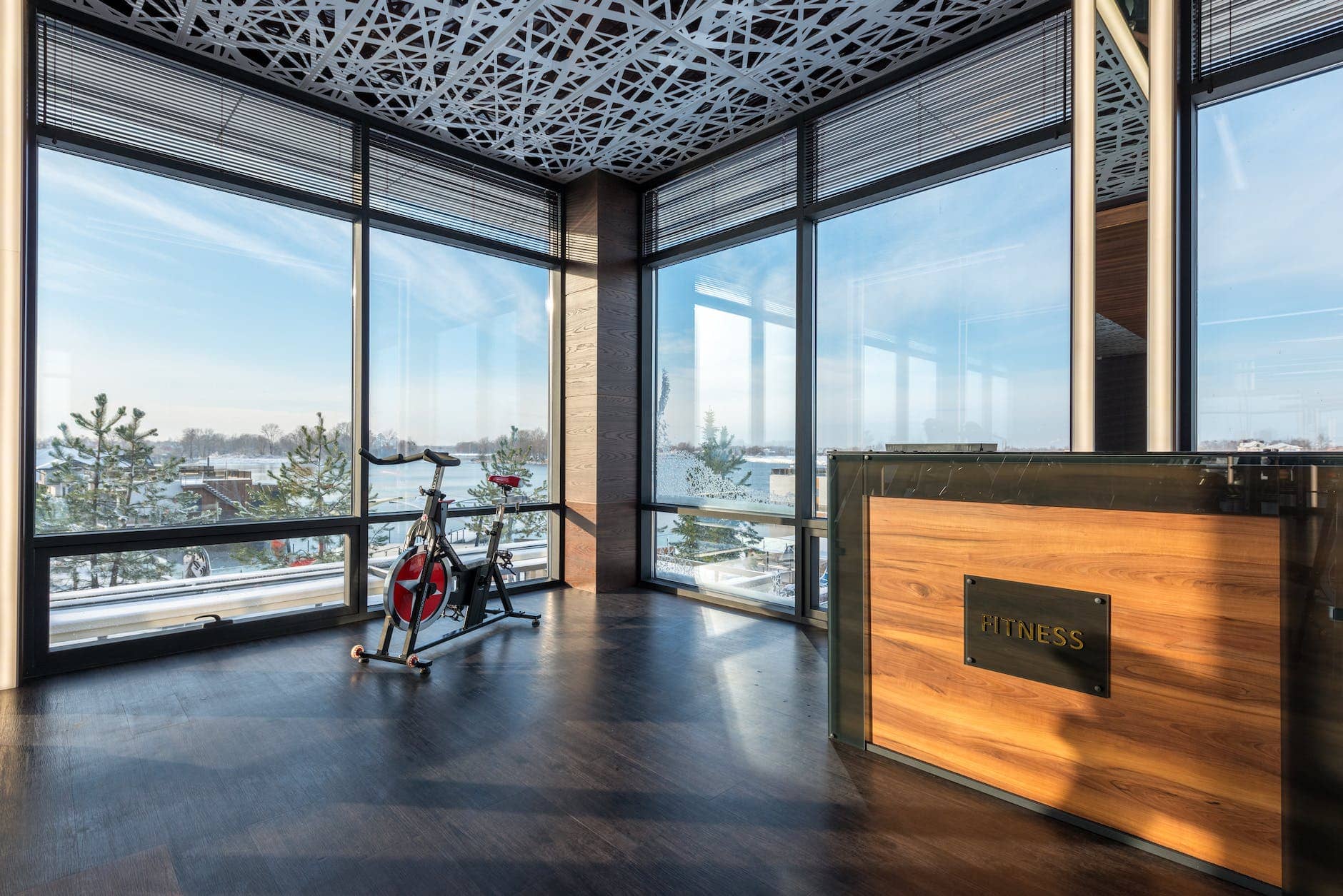 bike machine placed near panoramic windows of contemporary gym
